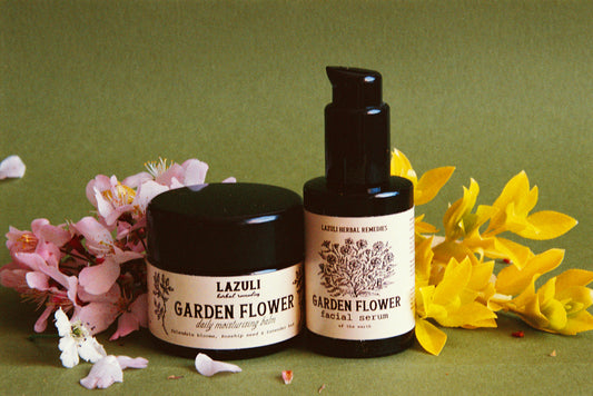 Two skincare products with 'Lazuli Garden Flower' branding on a green background with flowers.