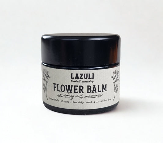 Jar of Lazuli Flower Balm on a white background